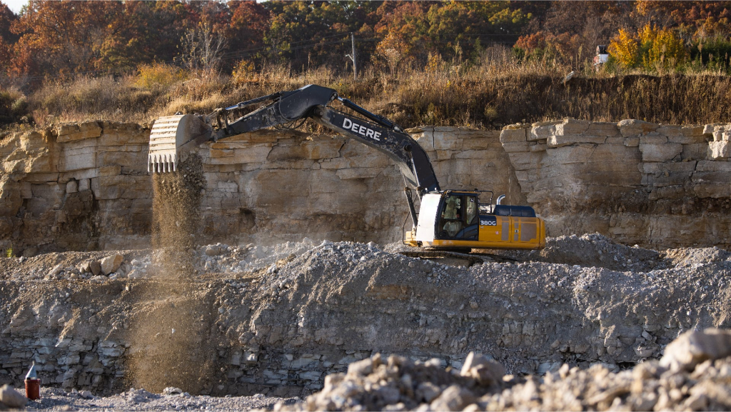 Excavator at rock quarry